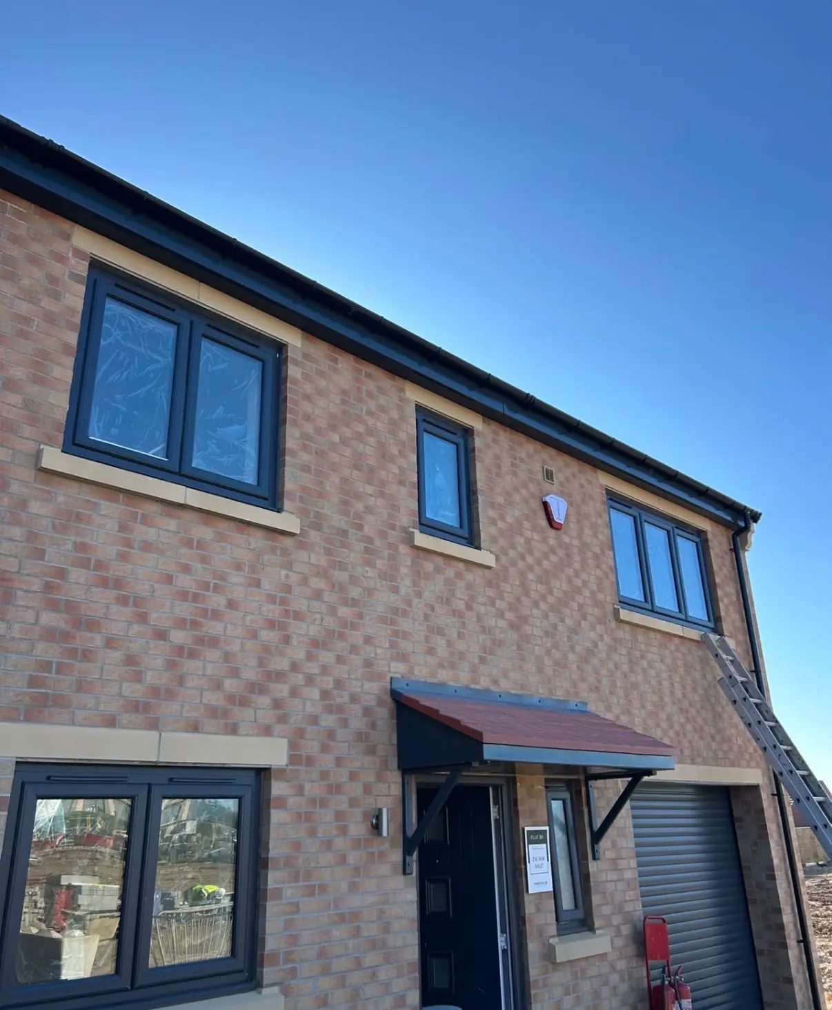 Brick home exterior with windows and perimeter joints
